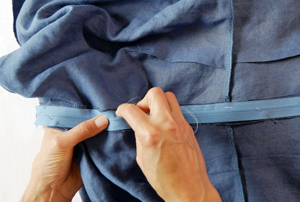 baste in a zipper to sew it in by hand