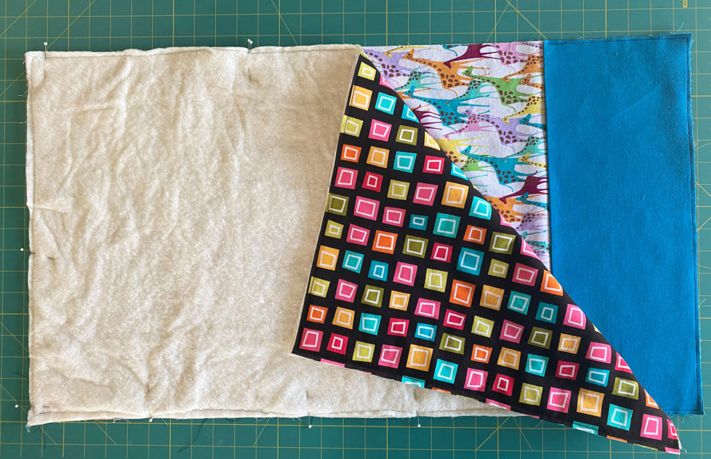 Make an easy to sew, foldable,  baby and tot changing pad with pocket for diapers and wipes