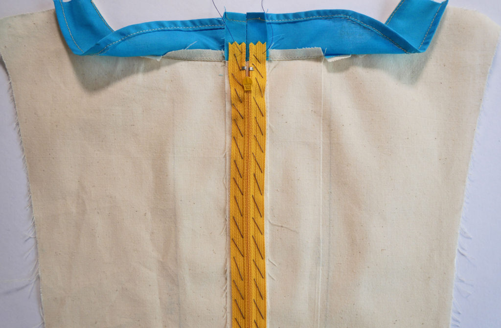 how to sew in a center zipper - basting it down first