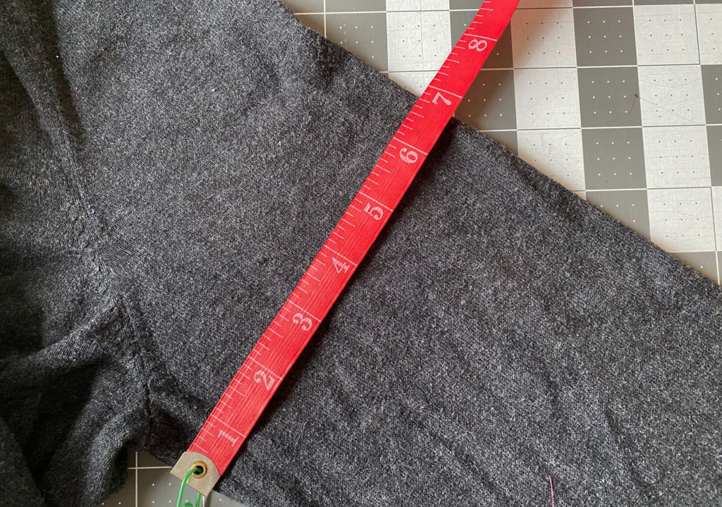 how to sew stripes onto a sleeve. Measure the width of the sleeve and remember it's doubled here.