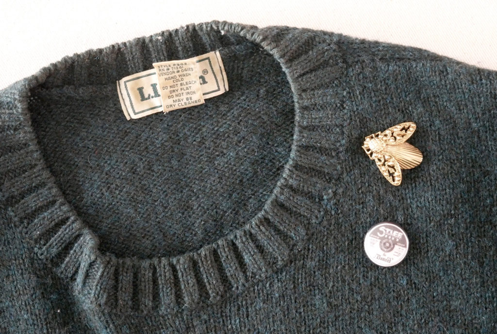 Use a pin, brooch or badge to cover a small hole