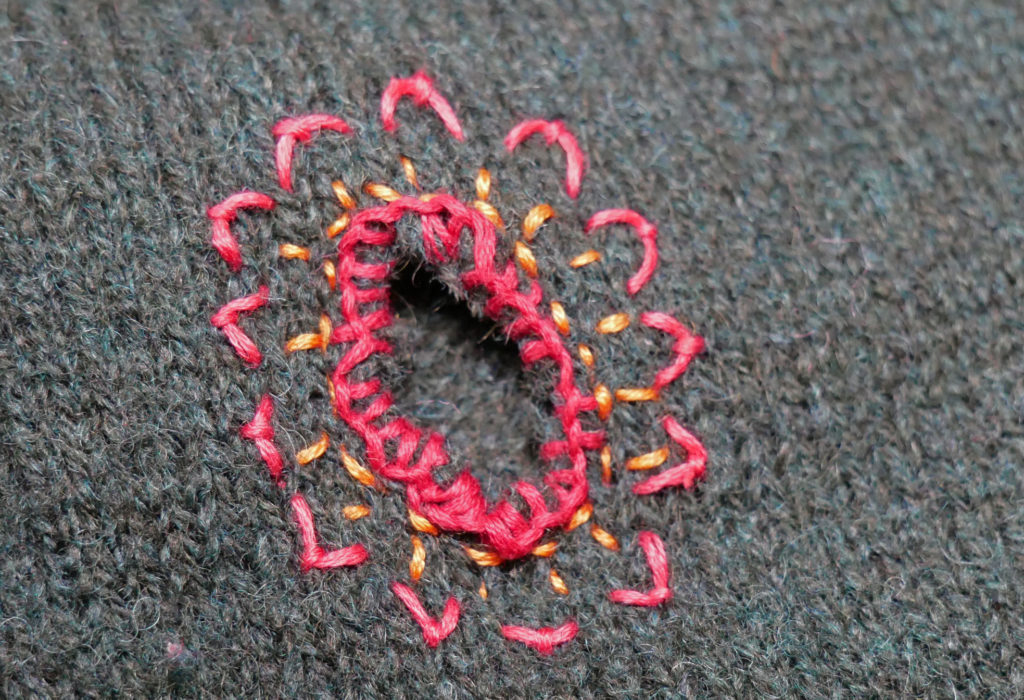 embroidery stitching arond a hole