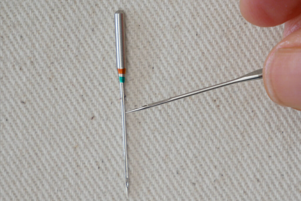 two sewing machine needles