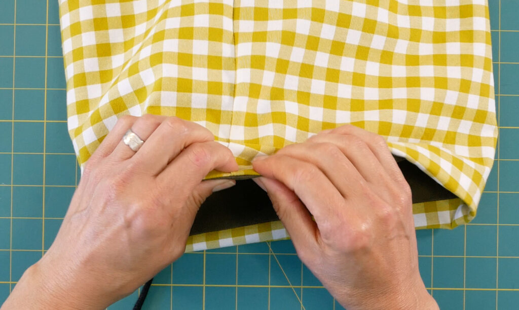 line up the top seam so it lays directly on the edge